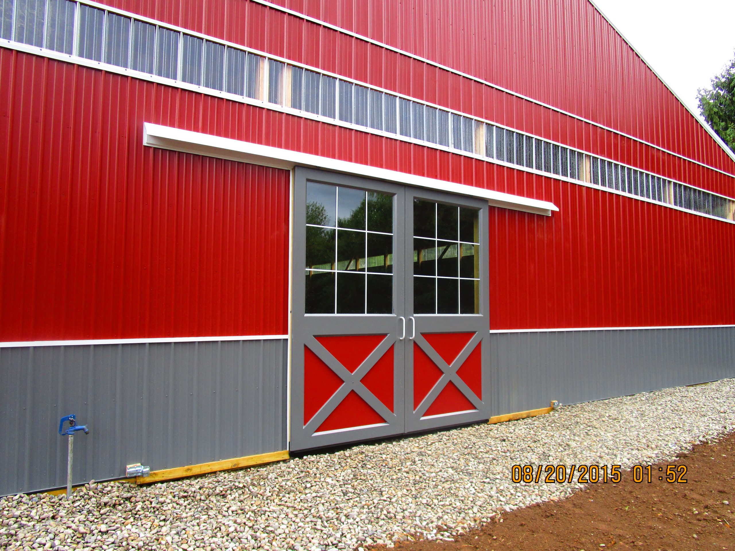 Split sliding door horse riding arena